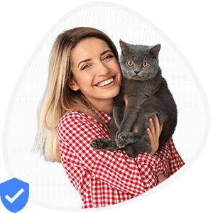 Isabella, a woman wearing red and white checks shirt holding a blackish grey cat on her shoulder provides Pet Sitting service