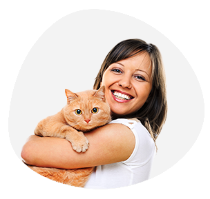 Cat parent holding a fluffy orange cat in her arms availing Pawland’s pet boarding services