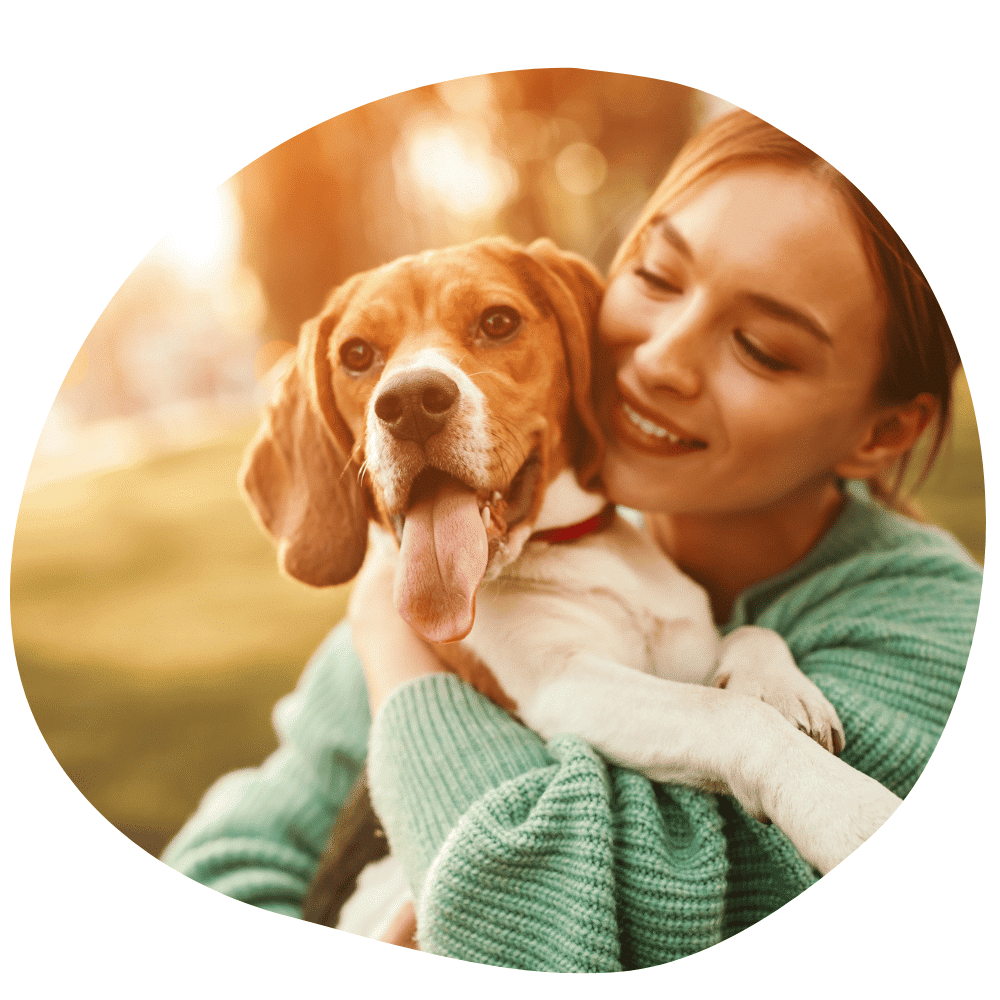 Dog parent wearing a green sweater after booking dog walking services in Dubai