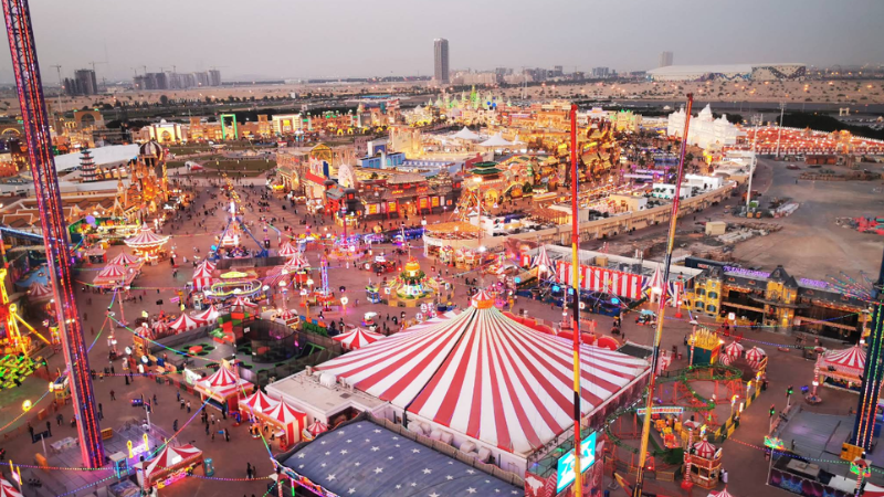 Full panoramic view of Global Village Dubai with illuminated international pavilions and vibrant night lights