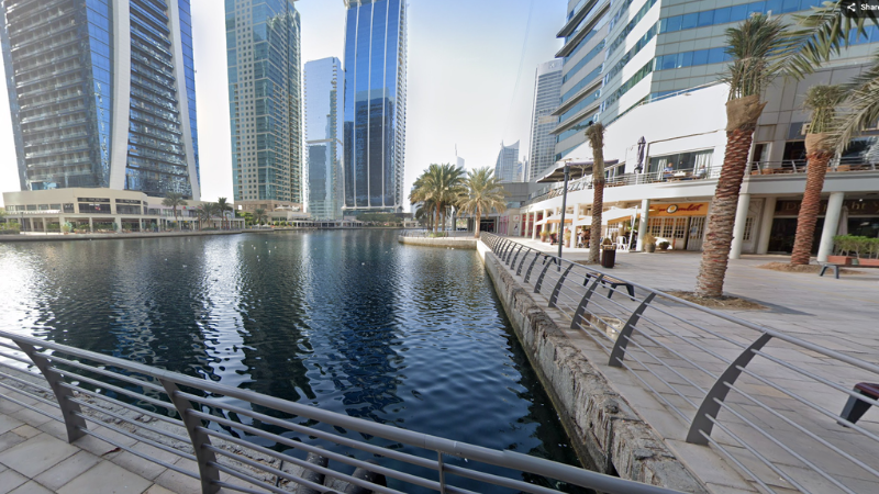 Jumeirah Lake Towers Free Zone (DMCC) with lake and road