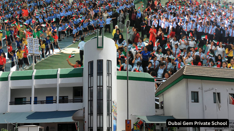 Students celebrating a national event with flags at Dubai Gem Private School, vibrant cultural unity and school spirit in Dubai