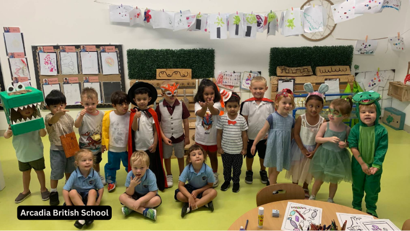 Young students at Arcadia British School sitting together in a classroom, enjoying a fun and engaging learning session in Dubai
