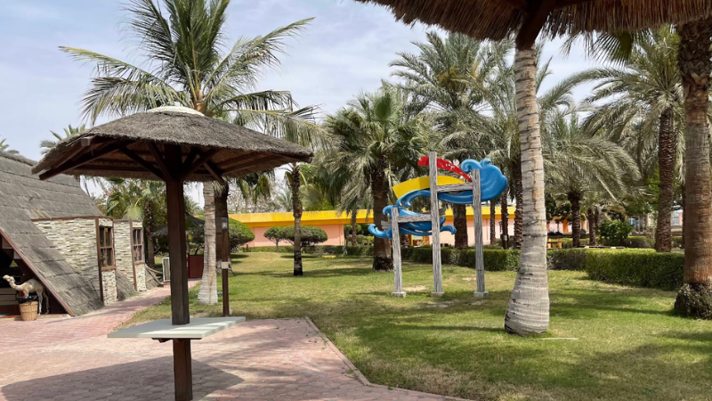 Aqua Park surrounded by lush green trees and natural landscape, offering a peaceful and refreshing outdoor view