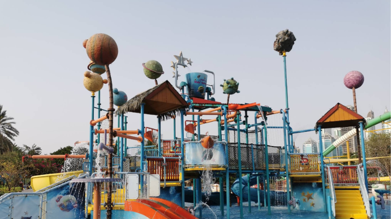 Pearls Kingdom Waterpark with a scenic river view flowing through the park, surrounded by attractions and relaxing outdoor surroundings