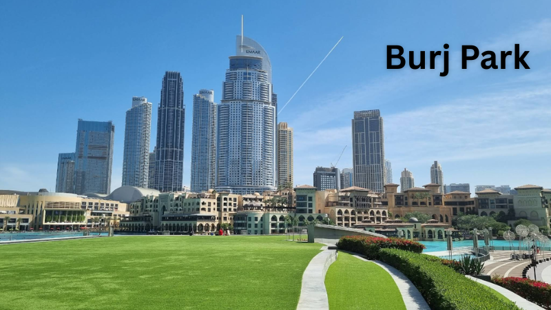 Lush green view of Burj Park with Emaar buildings in the background, Downtown Dubai skyline visible beyond