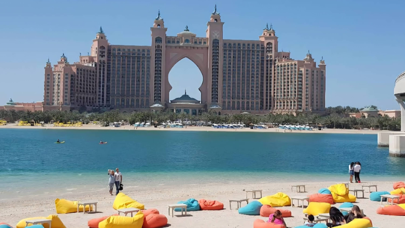 People are Capturing together in font of beache at Plam Jumierah 