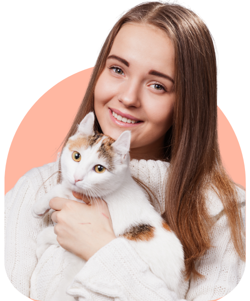A girl cat sitter in Dubai holding a white cat with a soft pale orange background.