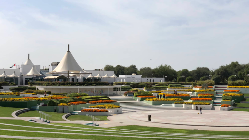 Al Mamzar Beach Park full garden view with lush greenery, palm trees, walking paths, and a relaxing seaside landscape in Dubai