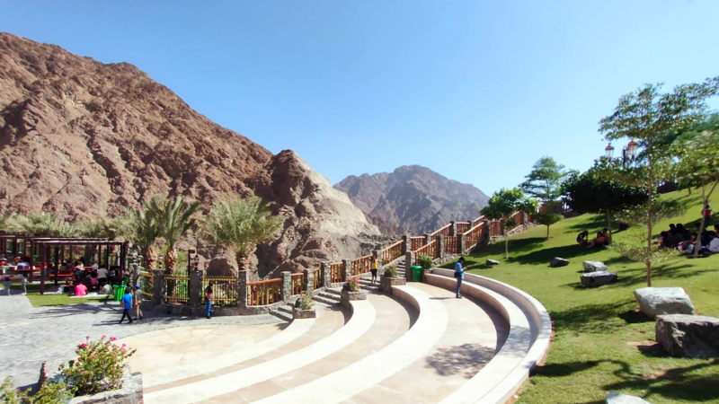 Seating area view at Shees Park with hill backdrop