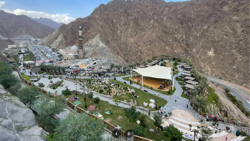 Full view of Shees Park in Sharjah with mountains and greenery