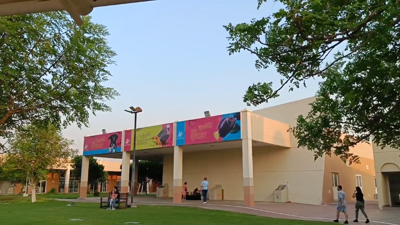 Main entrance of Al Warsan Pet Market Dubai with visitors gathered near the gate