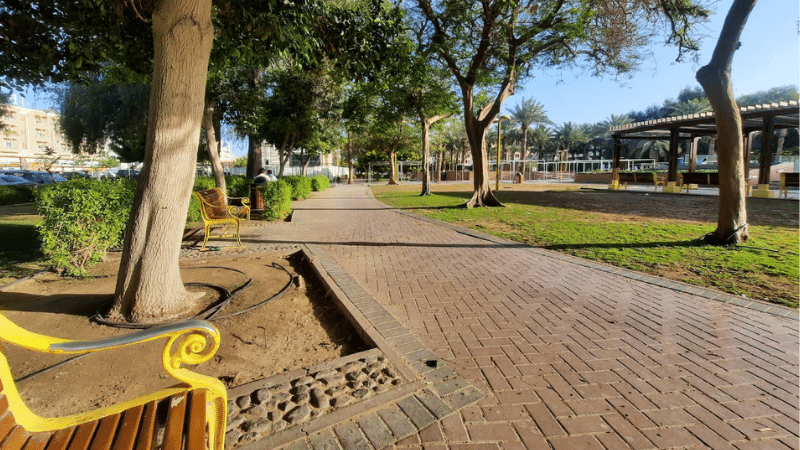 Al Karama Park view with chairs and green gardens