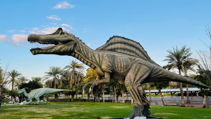 Two life-sized dinosaur statues displayed inside Dinosaur Park Dubai.