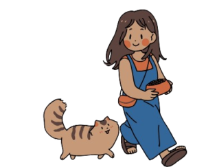 A girl cat owner are feeding her cat with enjoying