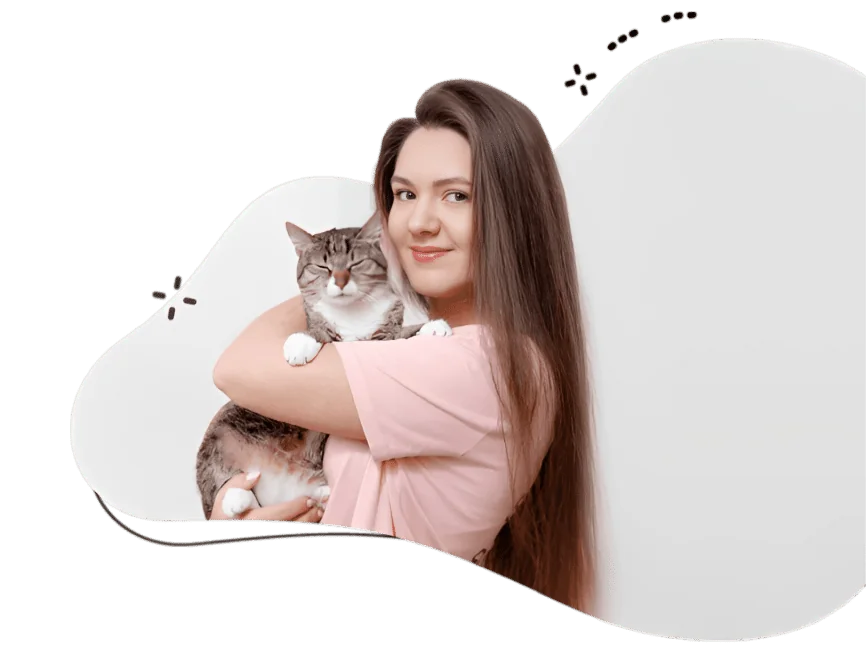 Pawland Cat Sitter Dubai holding the british longhair cat in her arms is providing cat boarding services in Dubai