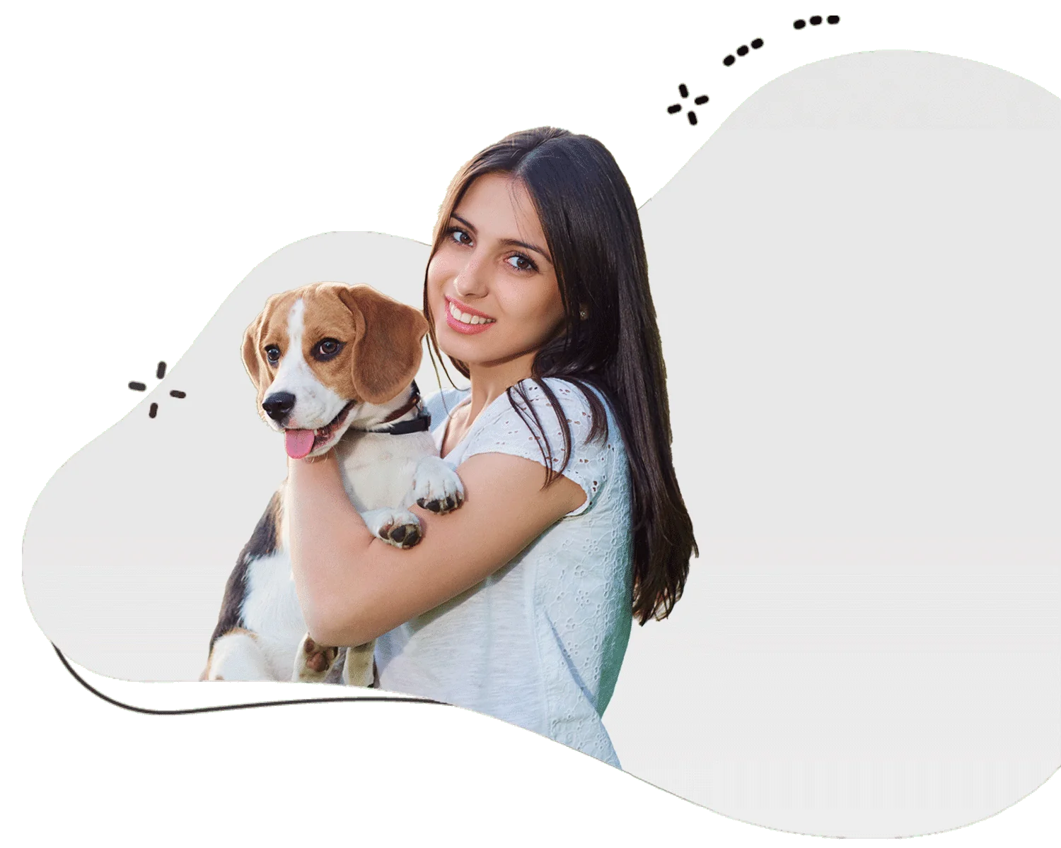 Loving female dog sitter wearing a grey shirt with brown hair holding a beagle in her arms